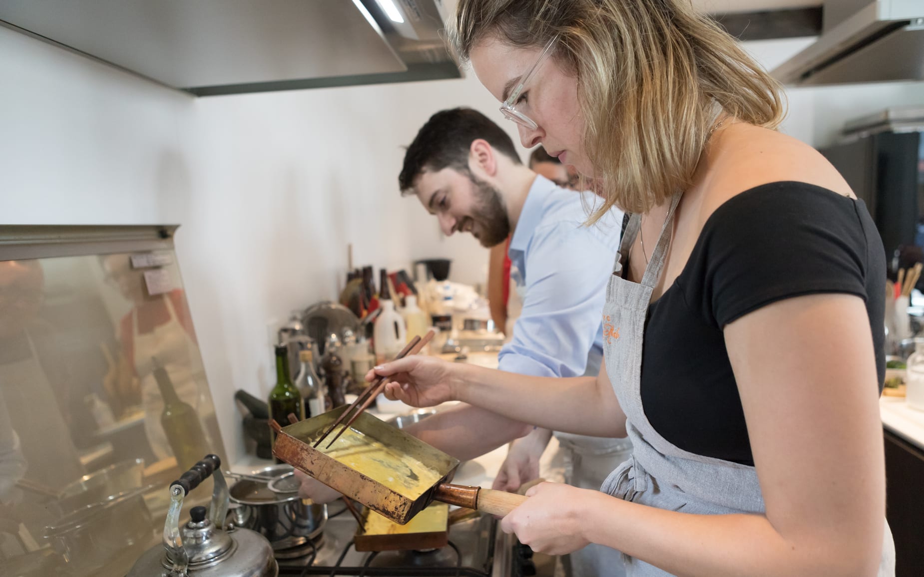 Guests cooking in the studio kitchen