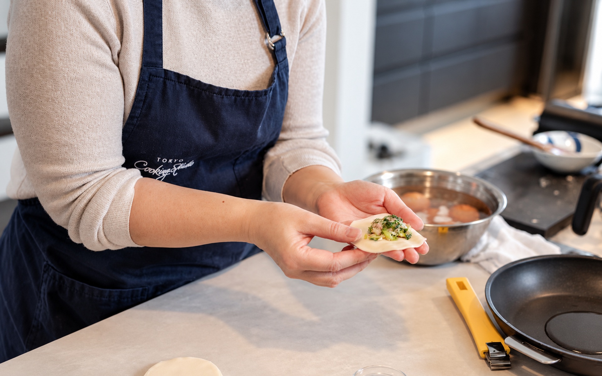 Folding gyoza by hand in Yukari’s kitchen